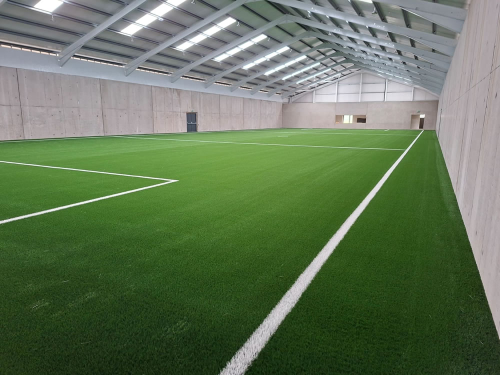 Indoor artificial grass training pitch complete at Carrickmore GFC in County Tyrone - Pitch contractor - PST Sport.