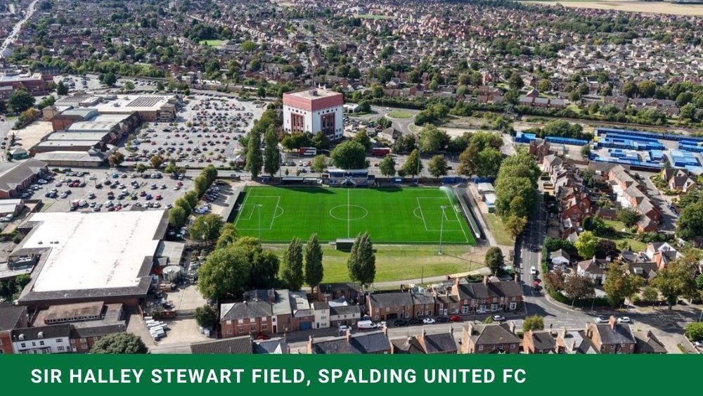 Aerial view of Spalding United FC’s FIFA Quality Pro artificial grass pitch at Sir Halley Stewart Field, surrounded by natural grass playing fields.